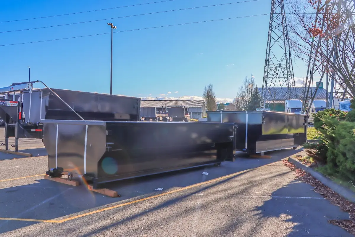 Roll-off dumpster ready for waste disposal at job site for Concrete Dumpster Rental in Medford